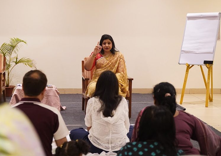 Dr. Monika guiding participants in a session