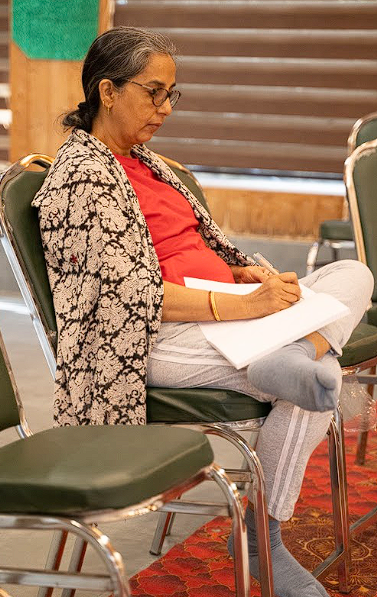 Participant writing reflections during the retreat