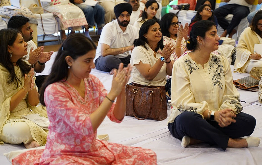 Participants seated together in prayer and stillness